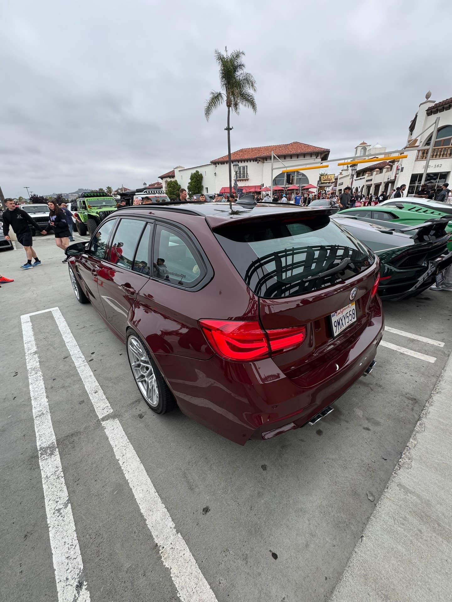 Sedan at a car meet, shot from the front quarter